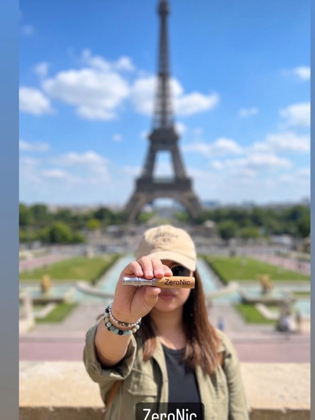 Holding the ZeroNic device in front of the Eiffel Tower
